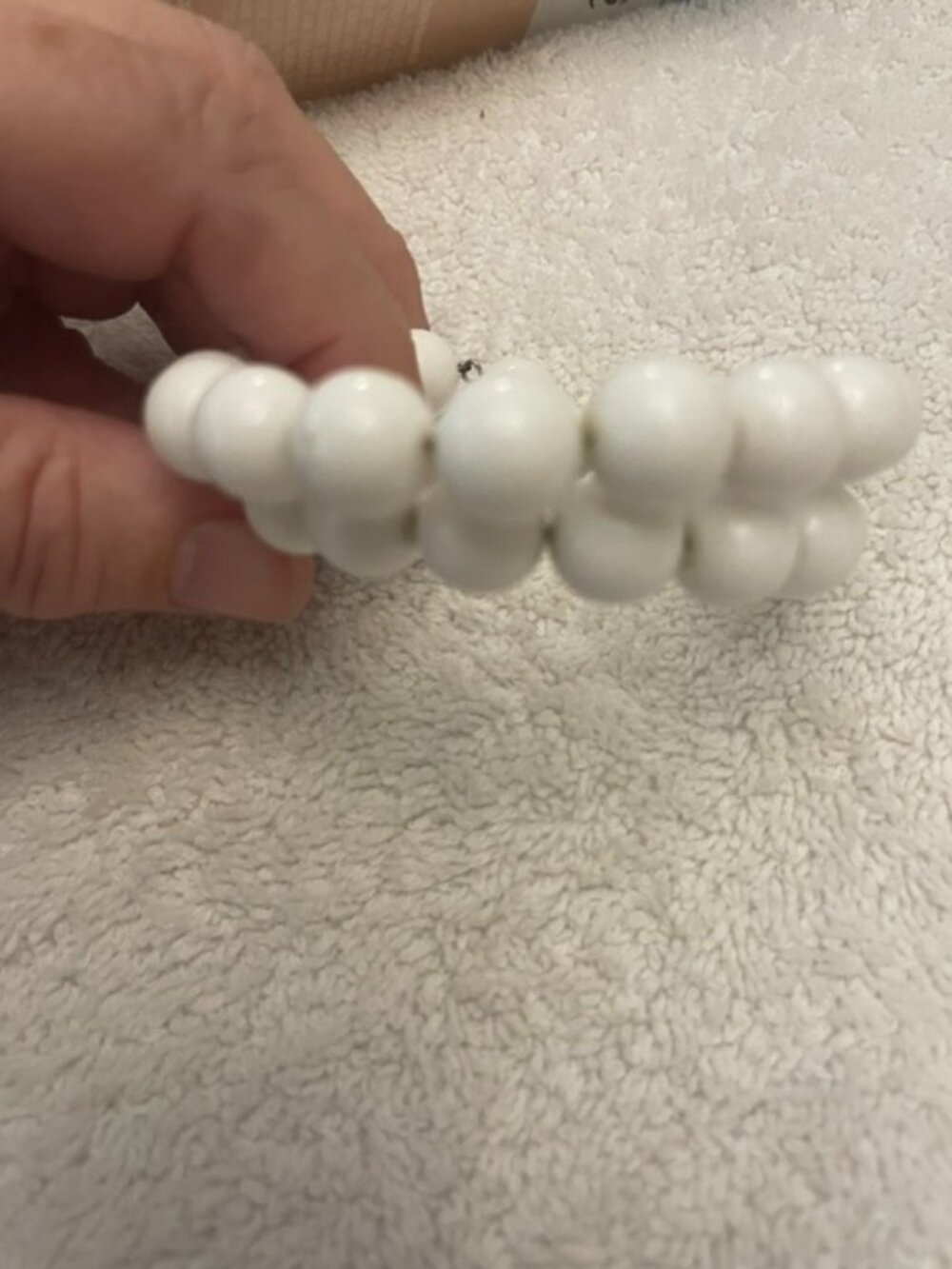 Vintage multi-wrap memory wire bracelet featuring large white plastic beads